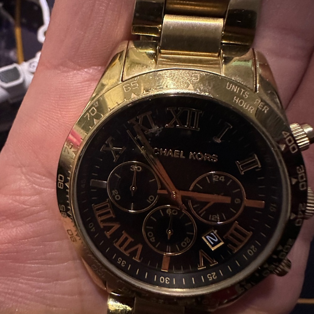 Men’s gold Michael kors watch
